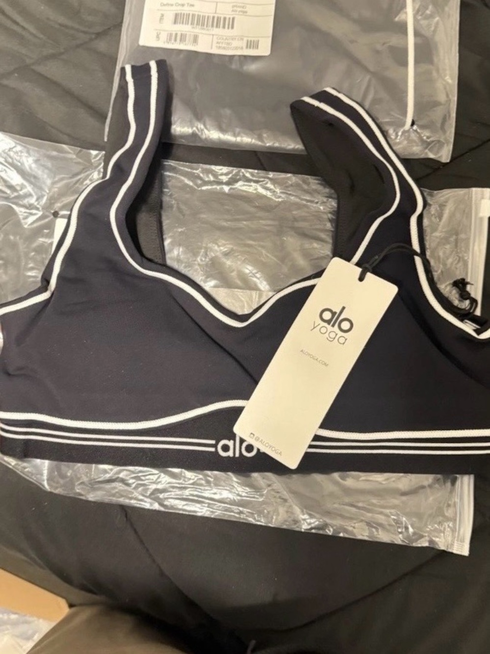 ALO Yoga Black Sports Bra with White Piping text 5045474637 if interested.